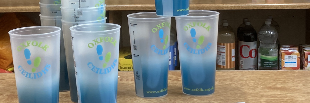 Oxfolk pint glasses on a bar